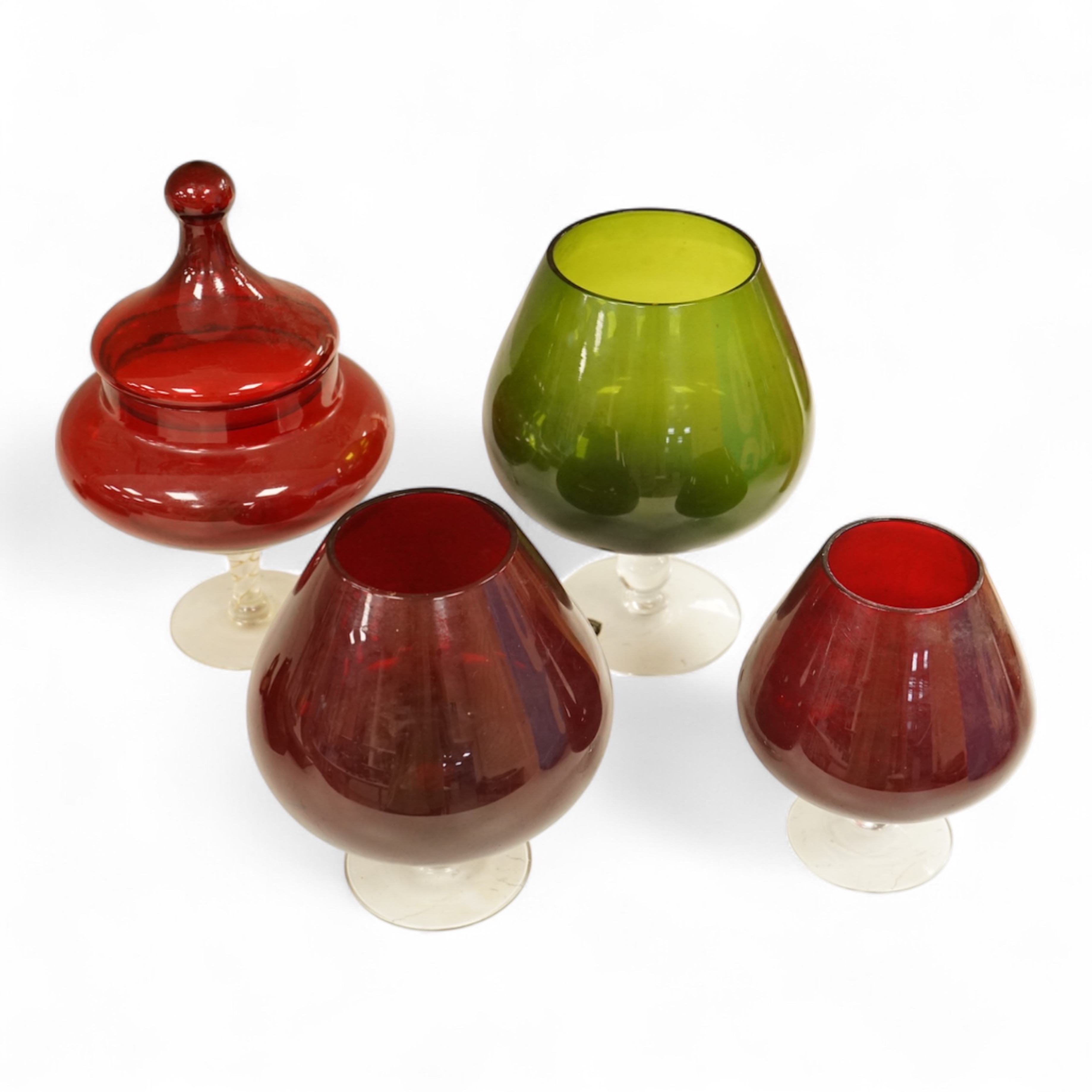 Five pieces of glassware to include a Swedish oversized brandy balloon, red glass sweetmeat dish and cover and a vase, largest 28cm high